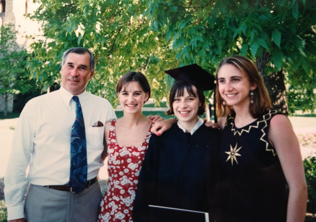 Graduation day with Dad and sisters